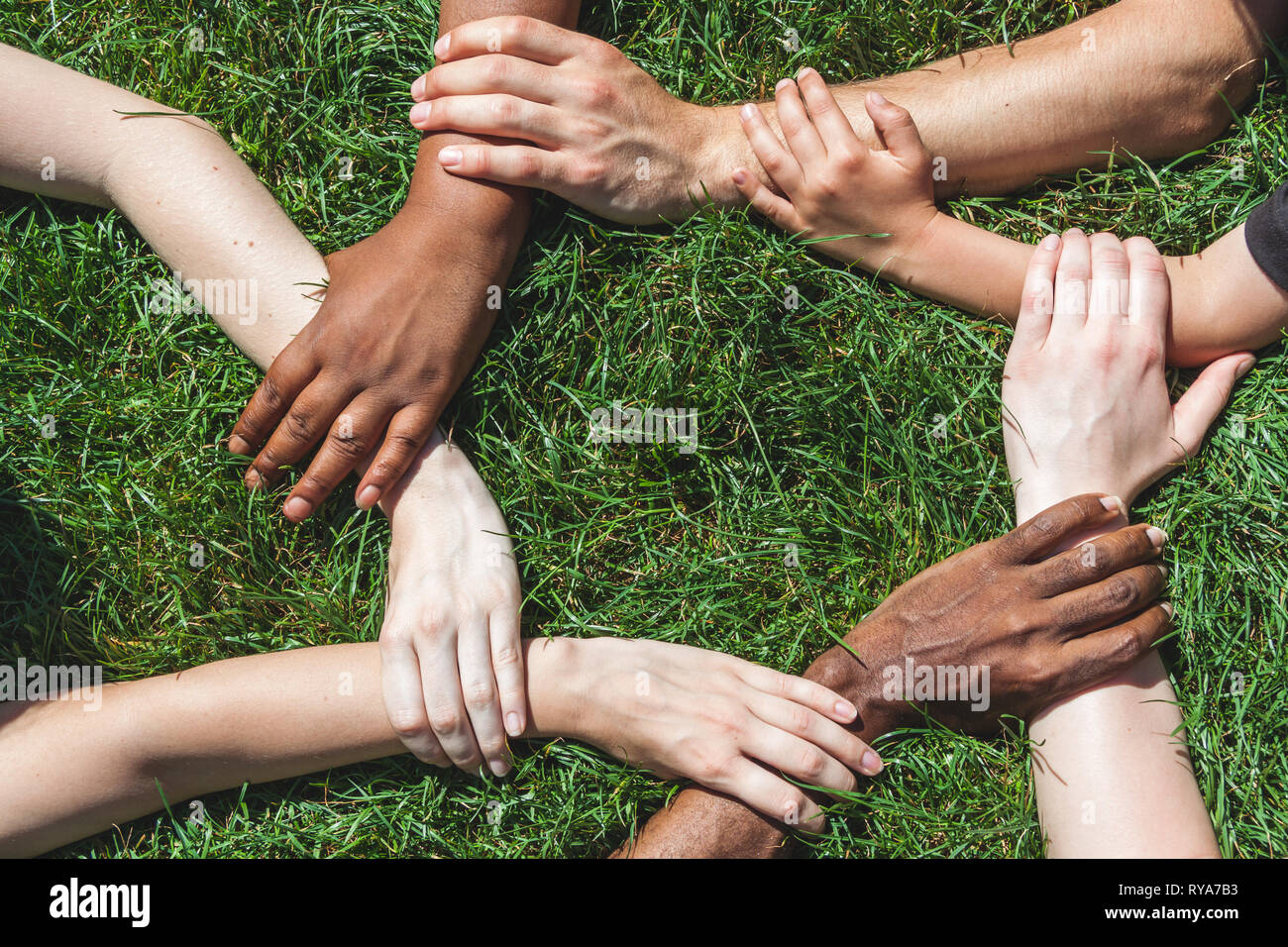 Society hold hands hi-res stock photography and images - Alamy