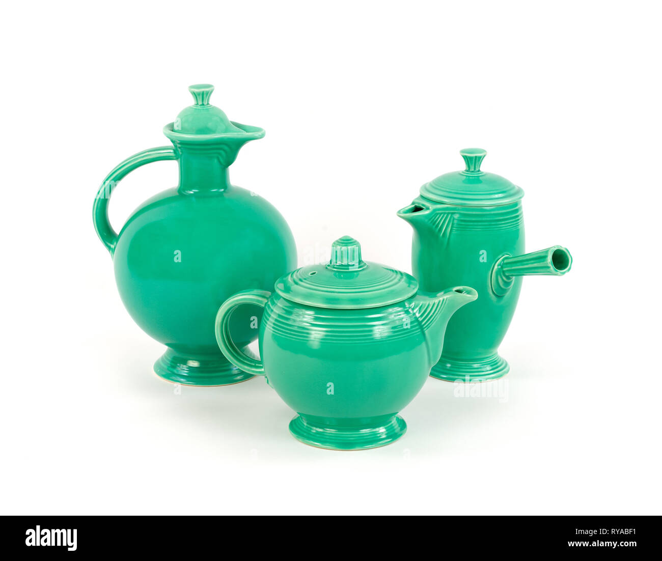 Three Unique Pieces of Original Green Glaze Vintage Antique Fiesta Ware Pottery, Tea pot, Demitasse Coffee Carafe and Water Pitcher Circa 1940's Stock Photo