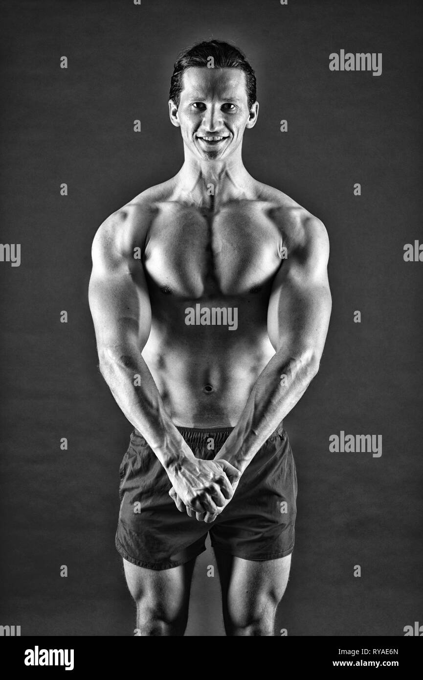Strong Built Man Man muscular athlete stand confidently. Attractive guy muscular chest ...