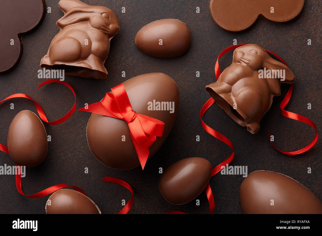 Easter composition with chocolate eggs and bunnies Stock Photo