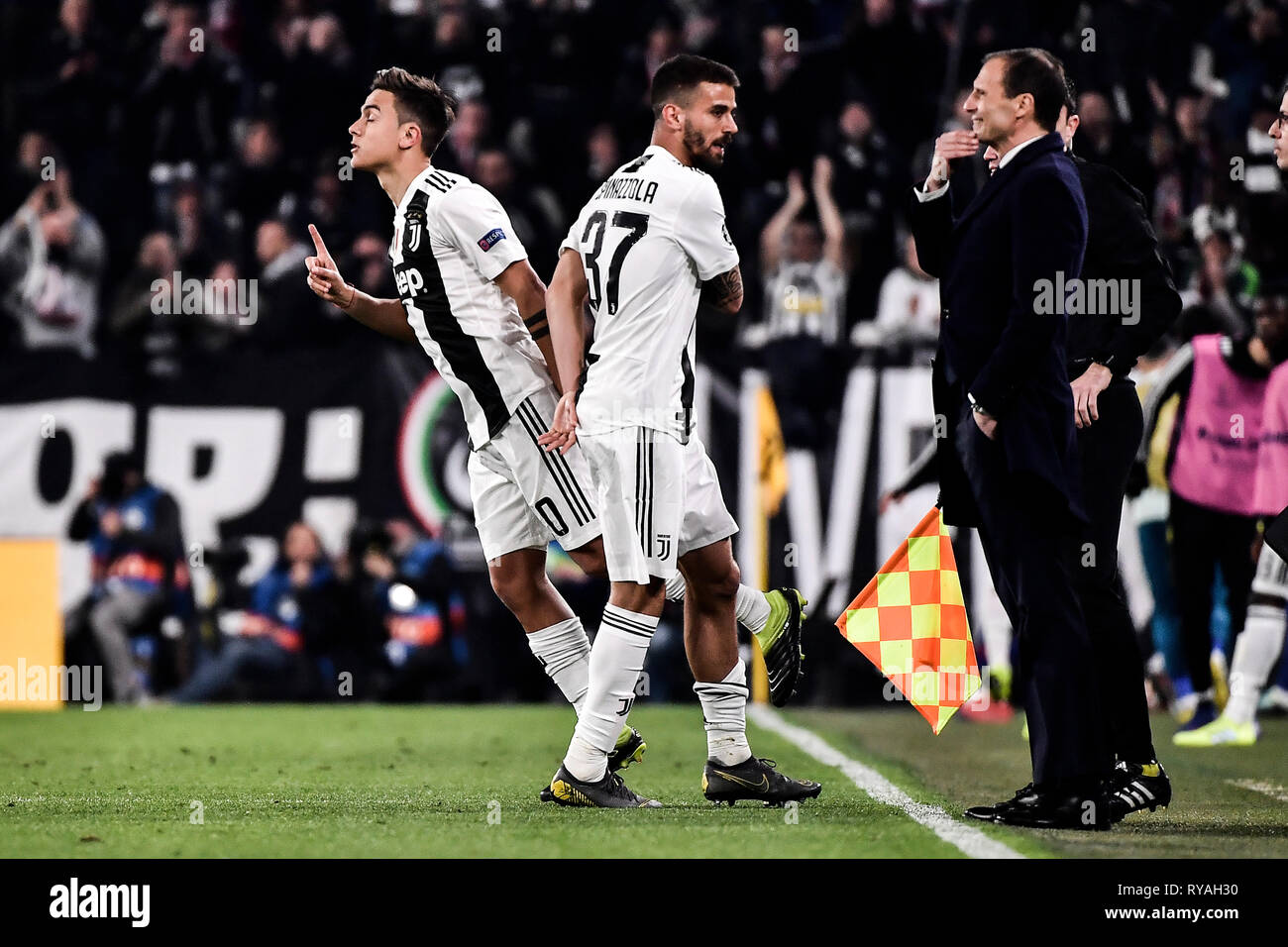 Turin, Italy. 12th Mar 2019. Juventus vs Atletico Madrid - Champions League  Ottavi di Finale - Stadio Allianz Stadium Nella foto: Paulo Dybala  (Juventus F.C.); Leonardo Spinazzola (Juventus F.C.);Massimiliano Allegri  (Juventus F.C.);