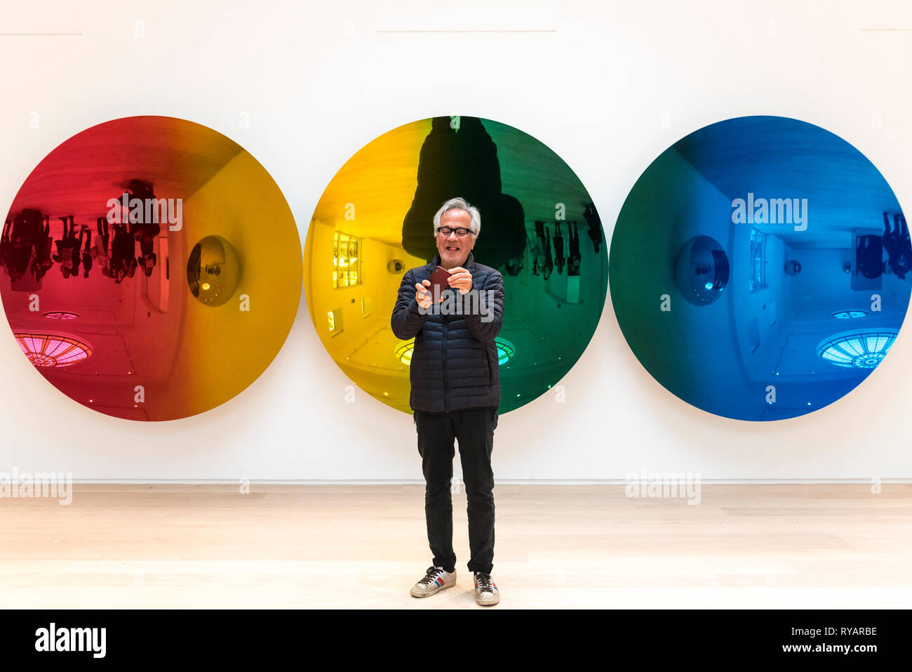 London, UK.  13 March 2019. Anish Kapoor poses next to his work "Red to Blue", 2016.  Photocall for the launch of a solo exhibition by Anish Kapoor, at the restored Pitzhanger Manor and Gallery, in Ealing.  The exhibition runs 16 March to 18 August 2019. Credit: Stephen Chung / Alamy Live News Stock Photo