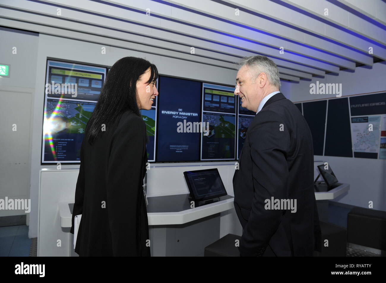 Glasgow, UK. 13 March 2019.  Mr Lochhead tries out an exhibit 'Be Energy Minister For The Day' is seen sitting at an interactive computer console which educates visitors all about energy usage and consumption.  Funding for Scotland’s four science centres will be announced during British Science Week.  Scotland is the only part of the UK where science centres are supported through annual funding. Credit: Colin Fisher/Alamy Live News Stock Photo