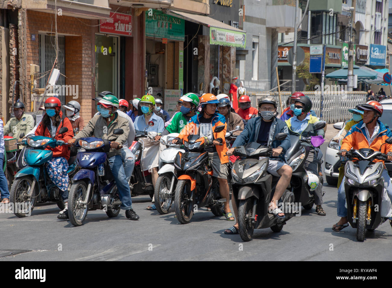 District 1,  Ho Chi Minh City, Vietnam, Wednesday 13th March 2019.  Saigon weather::Hot spring day with highs of 36 degrees. Siaon is well known for the busy street traffic with many scooters and bikes Credit: WansfordPhoto/Alamy Live News Stock Photo