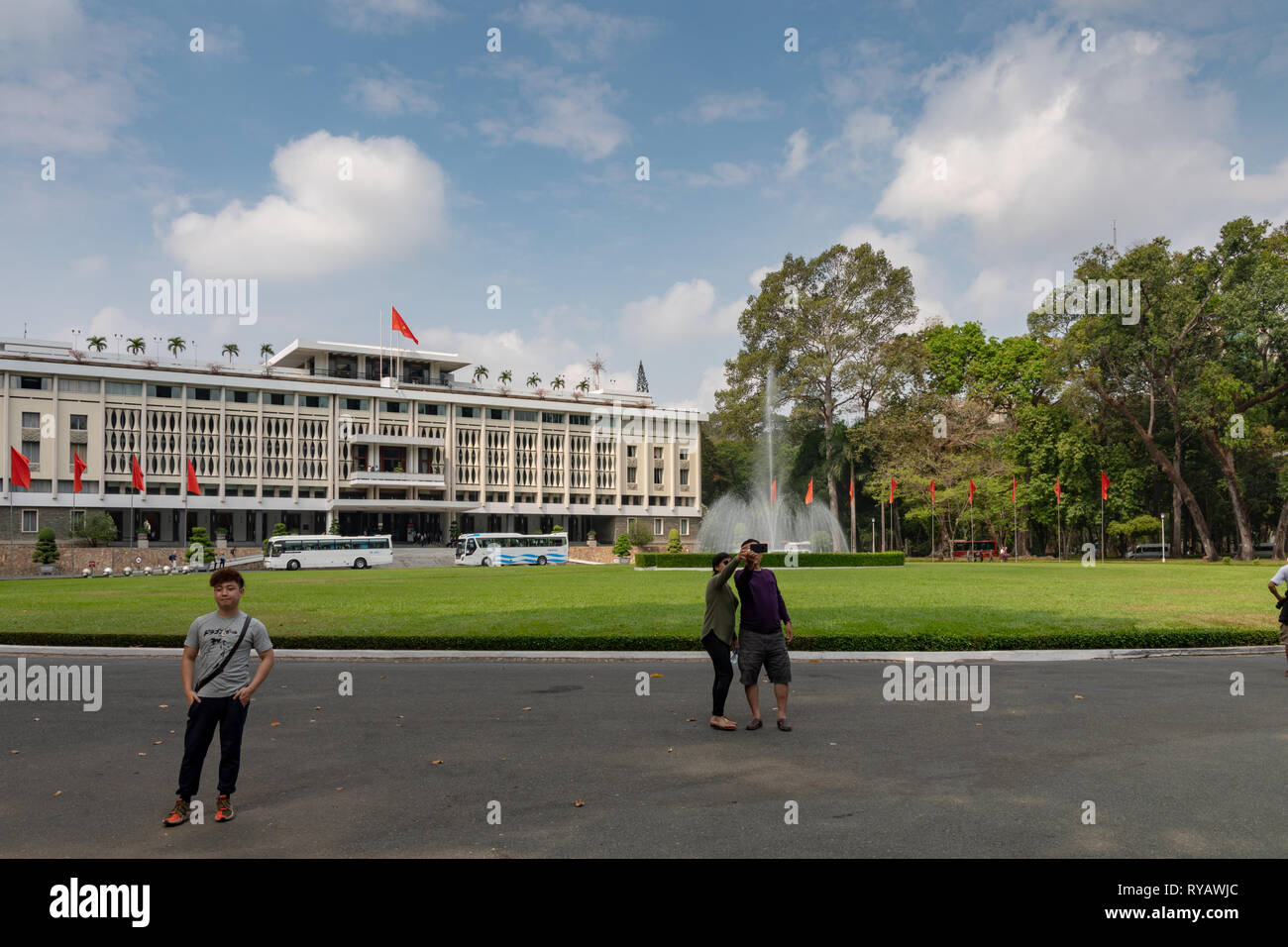 District 1,  Ho Chi Minh City, Vietnam, Wednesday 13th March 2019.  Saigon weather::Hot spring day with highs of 36 degrees. . View of gardens and skyline from Reunification Palace which was the base of  Vietnamese General Ngo Dinh Diem until his death in 1963. It made its name in global history in 1975. A tank belonging to the North Vietnamese Army crashed through its main gate, ending the Vietnam War. Credit: WansfordPhoto/Alamy Live News Stock Photo