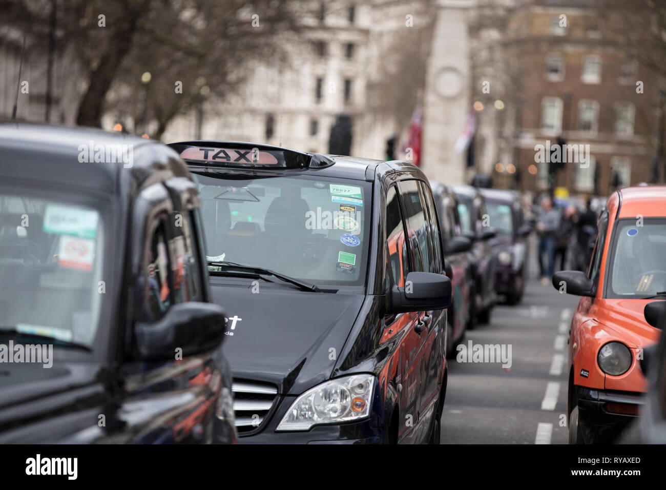 LONDON, UK - March 13th 2019: Black cabs block roads around Westminster in protest over plans to ban them driving on roads in parts of London Credit: Ink Drop/Alamy Live News Stock Photo