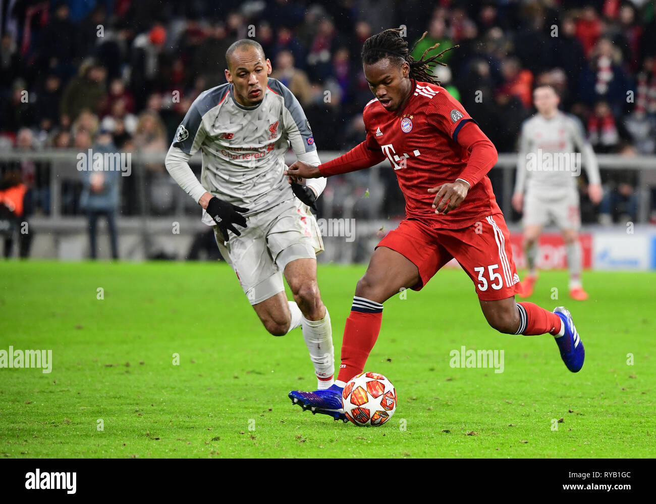 Munich, Germany. 13th Mar, 2019. Soccer: Champions League, knockout round, round of sixteen, second leg: FC Bayern Munich - FC Liverpool in the Allianz Arena. Munich's Renato Sanches (r) and Liverpool's Joel Matip fight for the ball. Photo: Peter Kneffel/dpa Stock Photo