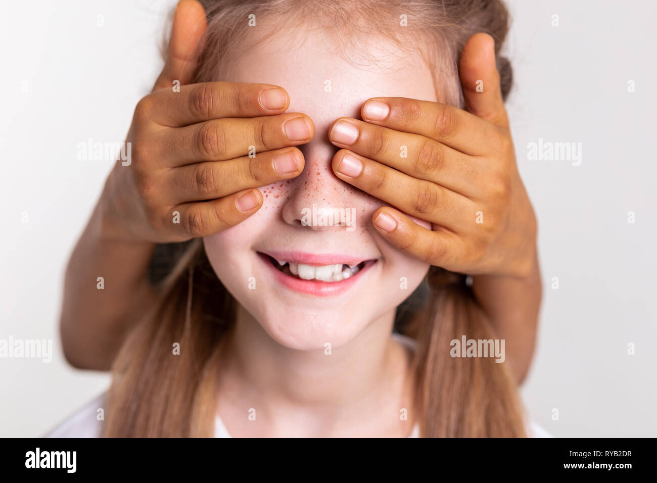 Contented pale girl with bright freckles having closed eyes Stock Photo