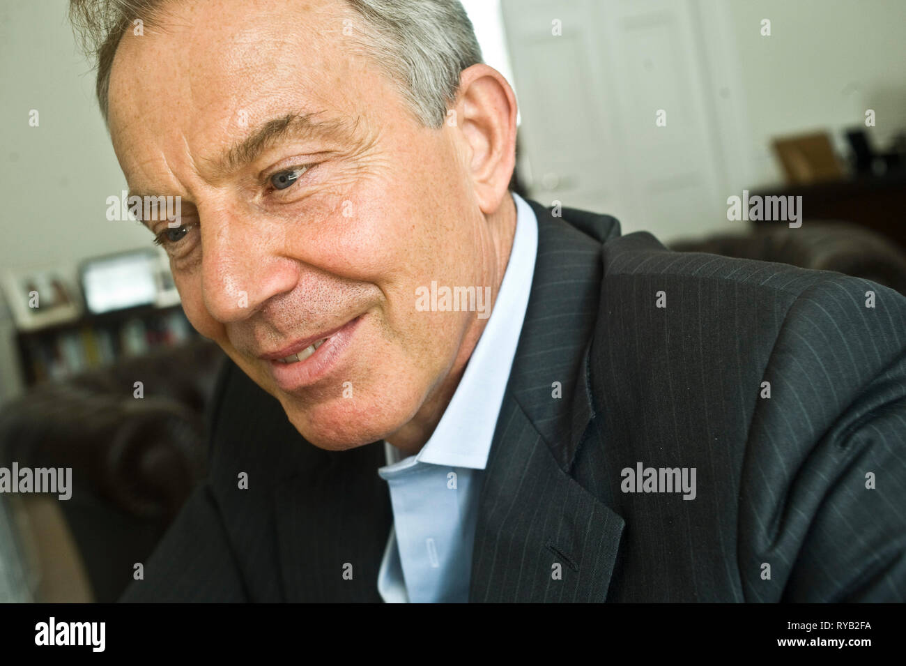 copy of the Koran / Qur'an on his desk.     Former British PM Tony Blair pictured in his  ' home office ' , 9 Grosvenor Square , London W1.      In between copious quantities of coffee the former PM was principally discussing his role in the Middle East Peace process as the Quartet Middle East Peace Envoy . Also commented on the Arab Spring, the crucial need to keep Iran's nuclear ambitions in check and the Pope's first tweet . The PM emphasised  the compatibility of world religion with global peace and prosperity and the wisdom he found both in the bible and  the Qur' an that he claimed to re Stock Photo