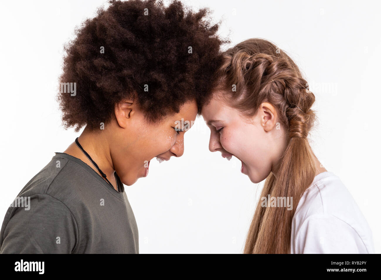 Aggressive good-looking children releasing emotions on each other Stock Photo