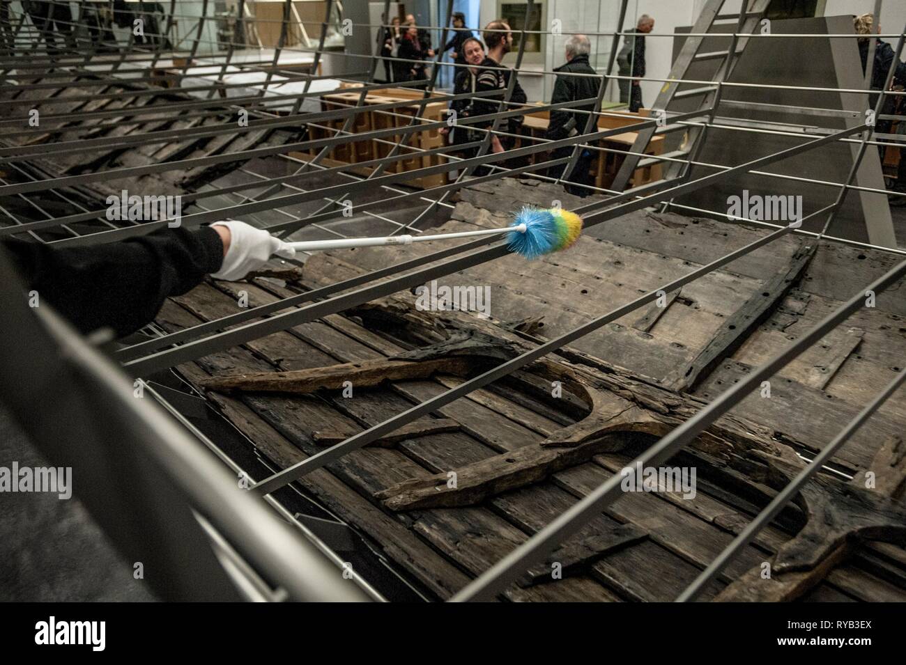 Views of surviving timbers from longest Viking warship ever found displayed in the UK for the first time. The timbers have been painstakingly fitted together like a huge jigsaw and placed inside an actual size steel cradle . The reconstruction work is by members National Museum of Denmark who have come over to the Museum especially.     The 37 metre long ship will form the centrepiece of the British Museum's BP exhibition, Vikings: life and legend.  The ship, known as Roskilde 6, was excavated from the banks of Roskilde fjord in Denmark during the course of work undertaken to develop the Roski Stock Photo