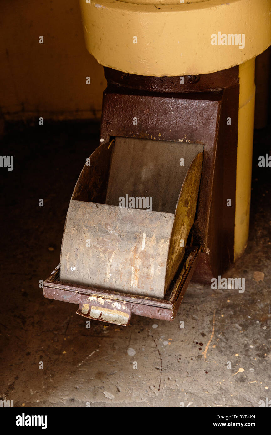 Old garbage chute in apartment building with cheap apartments Rubbish