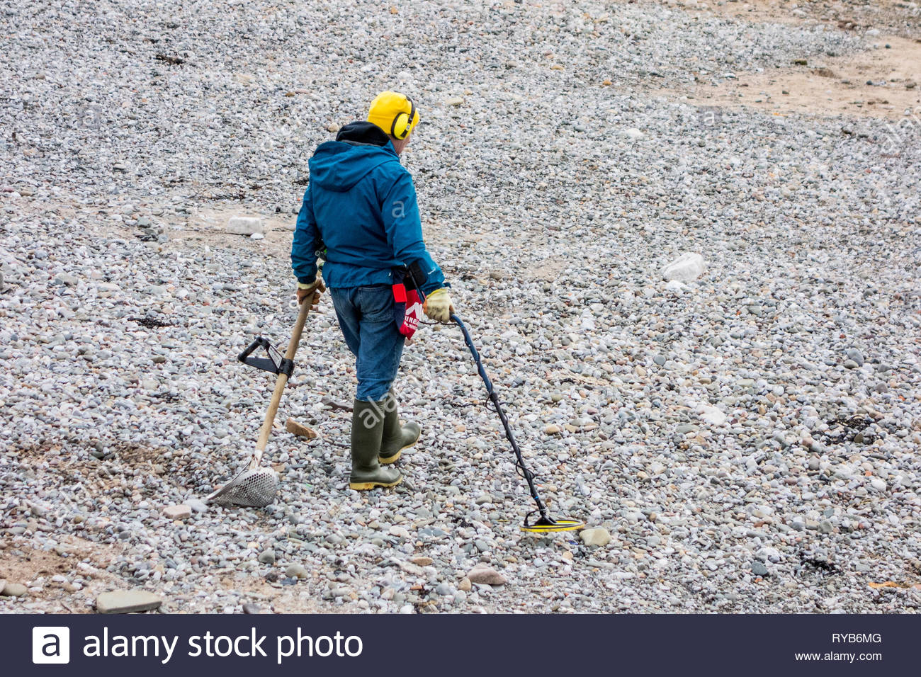 Metal Detecting On A Beach High Resolution Stock Photography and Images