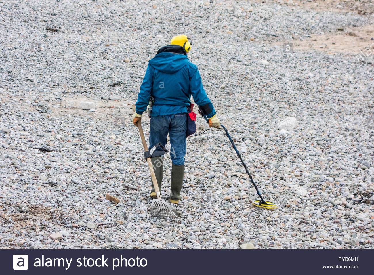Metal Detecting On A Beach High Resolution Stock Photography and Images