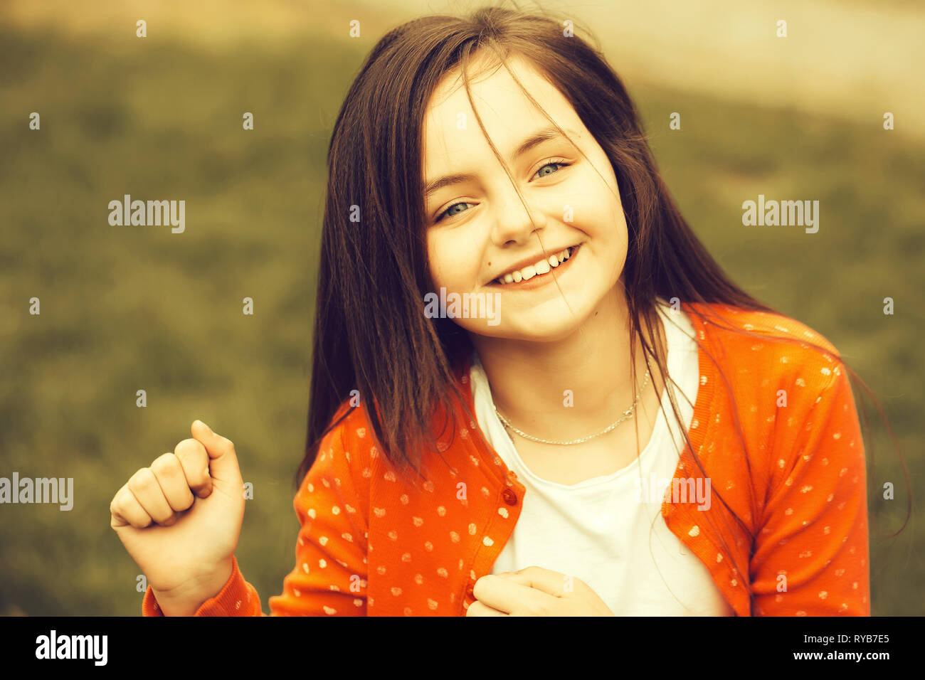 Happy smiling small girl outdoor Stock Photo - Alamy