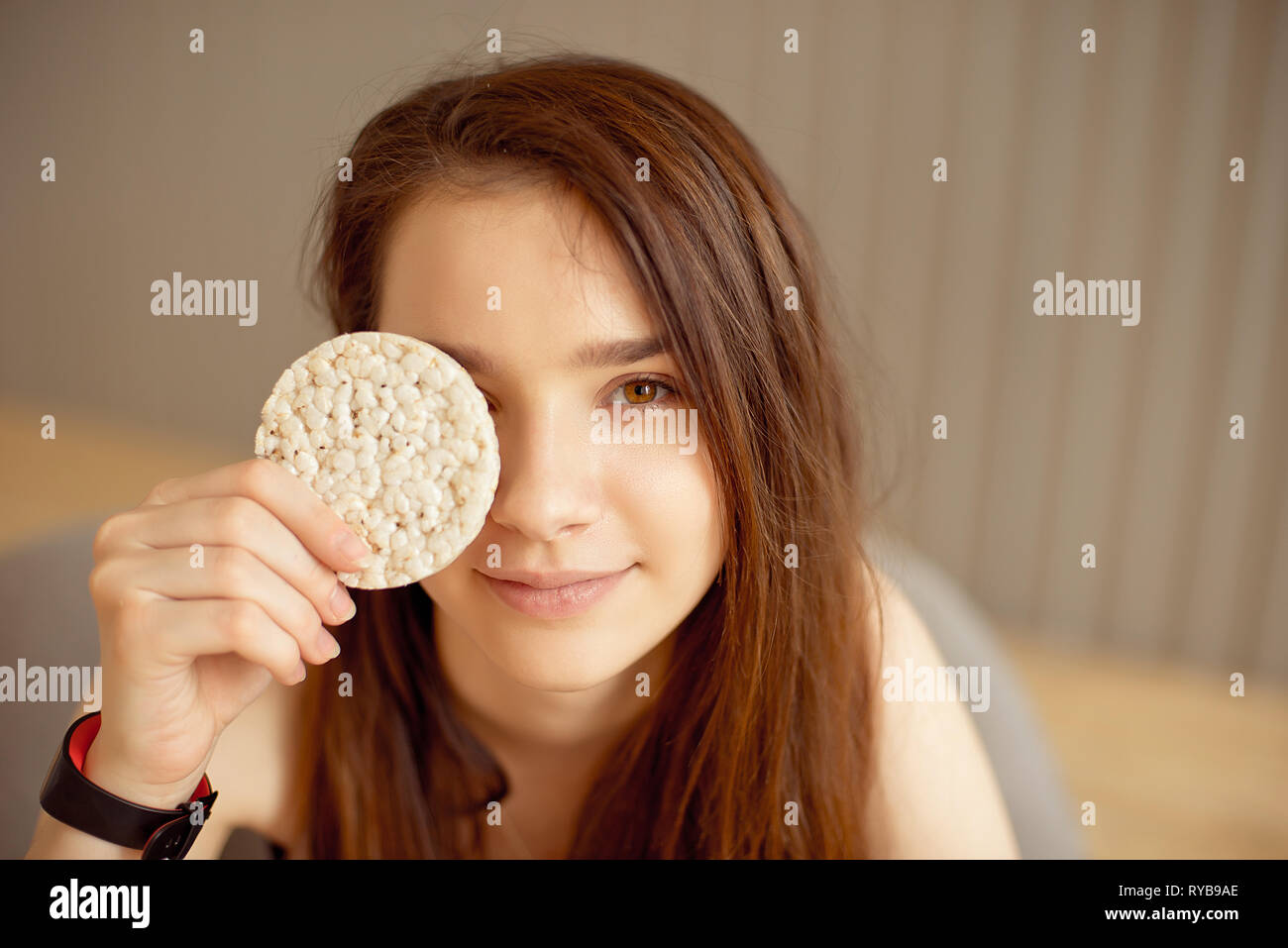 Athletic girl holding crunchy rice cakes, healthy food, healthy