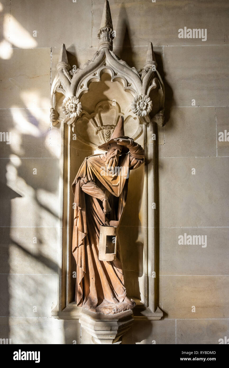 Monks statue looking like Gandalf the Wizard in Lacock Abbey, Wiltshire, UK on 10 March 2019 Stock Photo