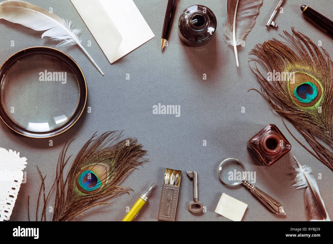 Vintage writing set with peacock feathers Stock Photo Alamy