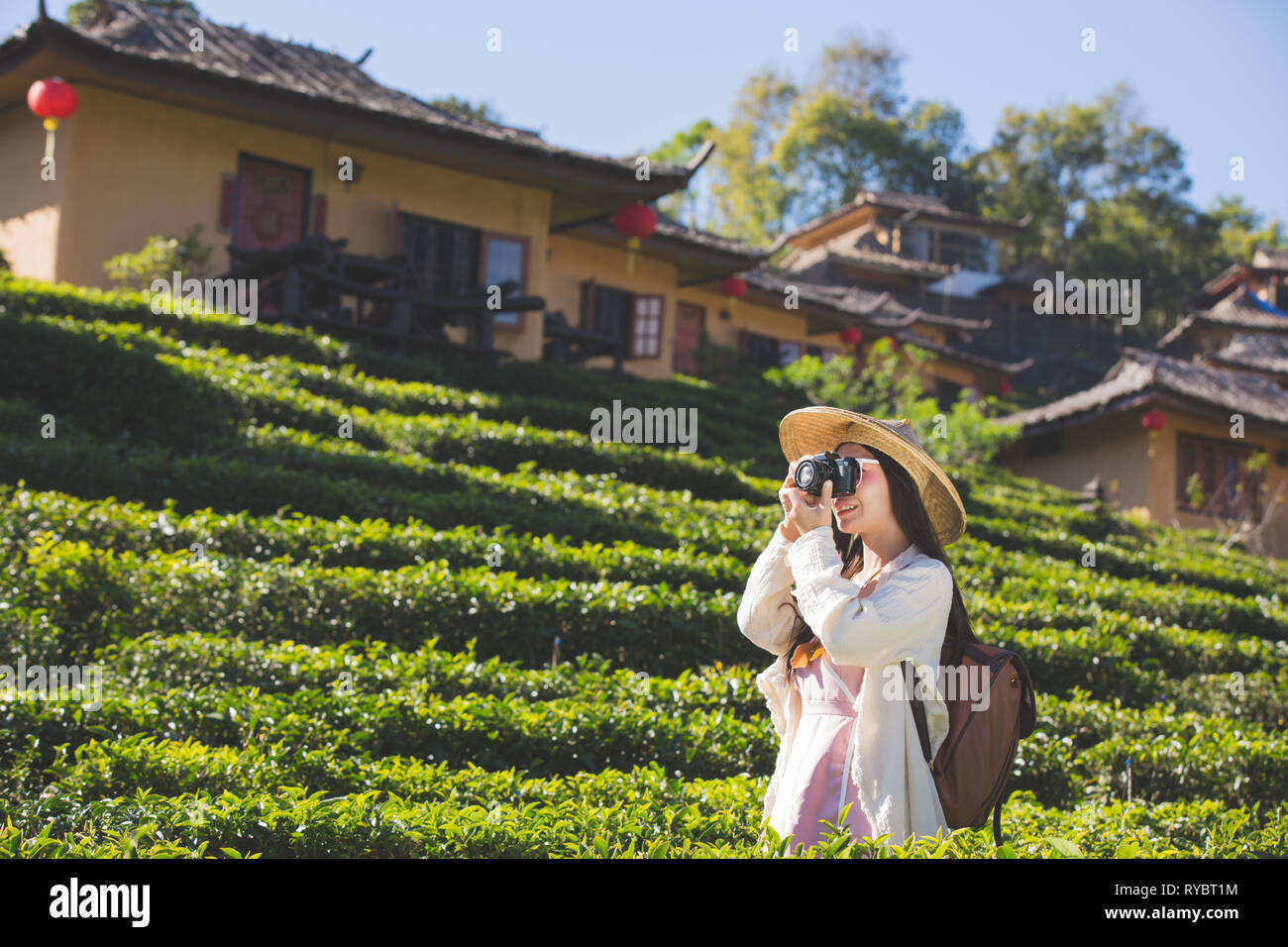 Female tourists who are taking photos of the atmosphere and smile happily. Stock Photo