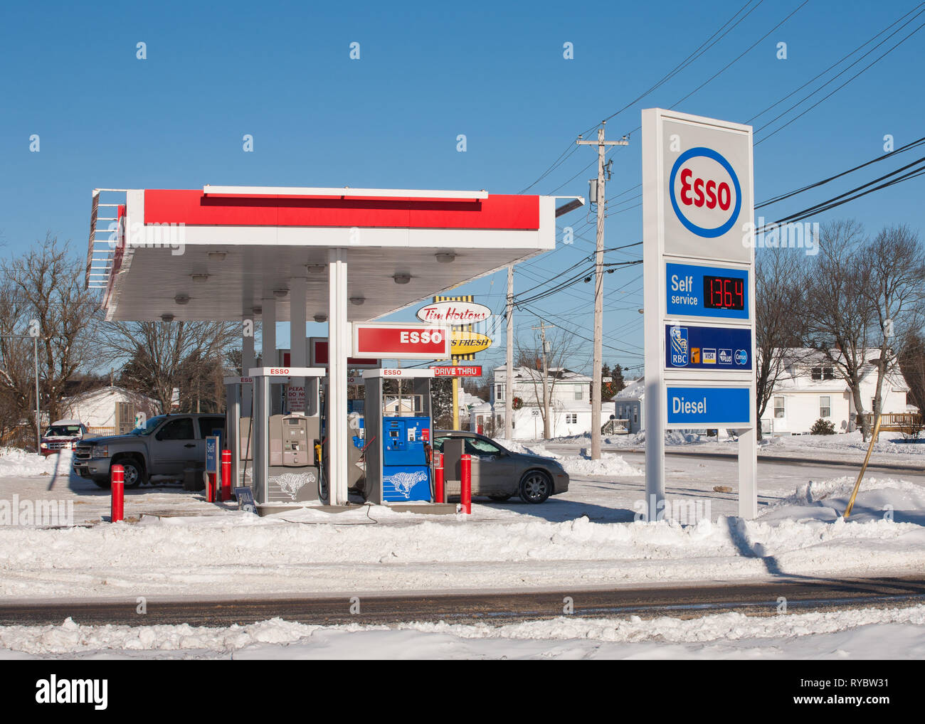 Brookfield, Canada - January 04, 2014: Esso gas station during Winter. Esso is one of the brand names for ExxonMobil along with Exxon and Mobil. Stock Photo