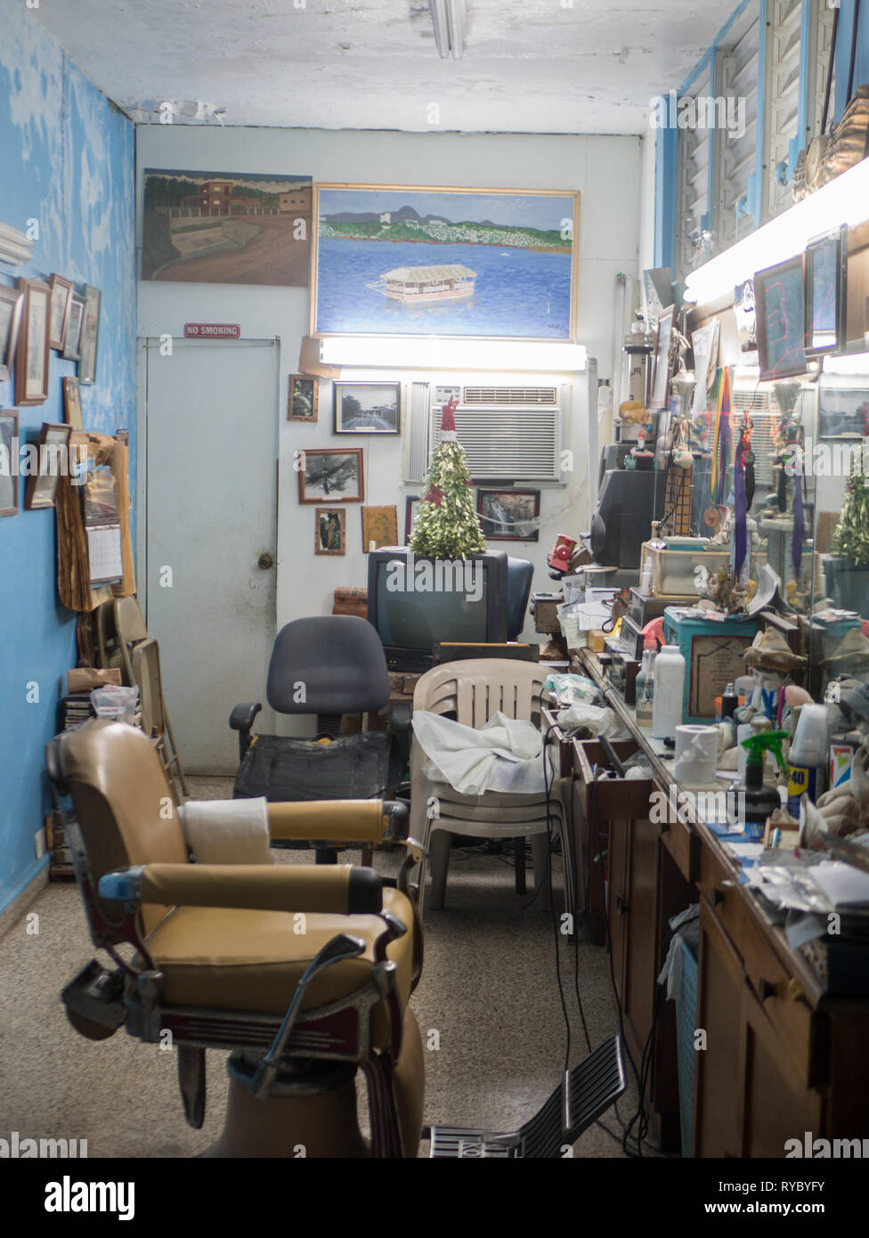 Puerto Rico. January 2019. Retro style haircut chair hairdresser in a vintage barber shop interior Stock Photo