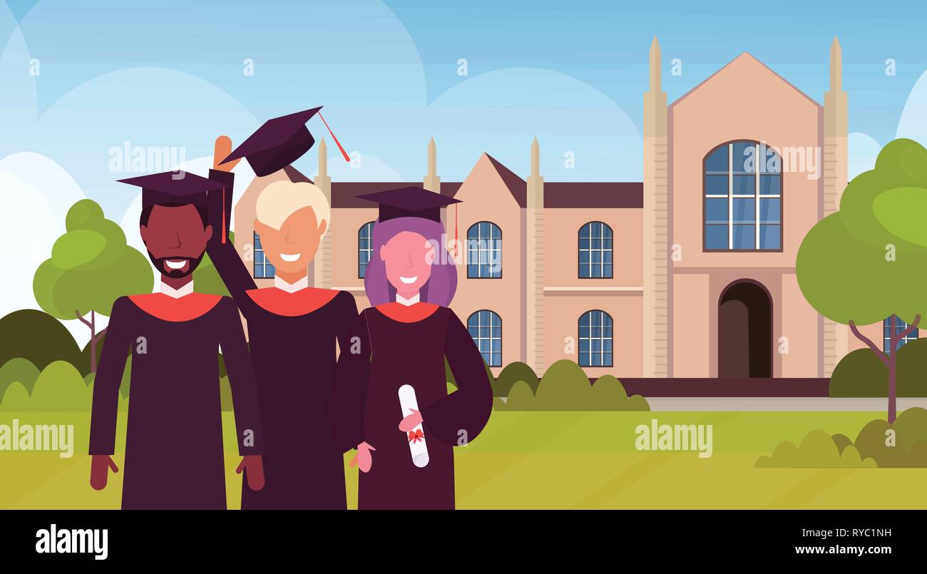group of mix race students in gown and cap standing together at campus ...