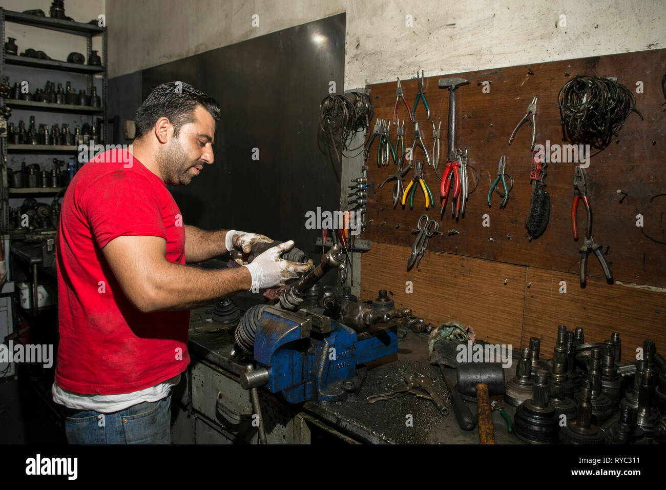 Mechanic working in garage Stock Photo
