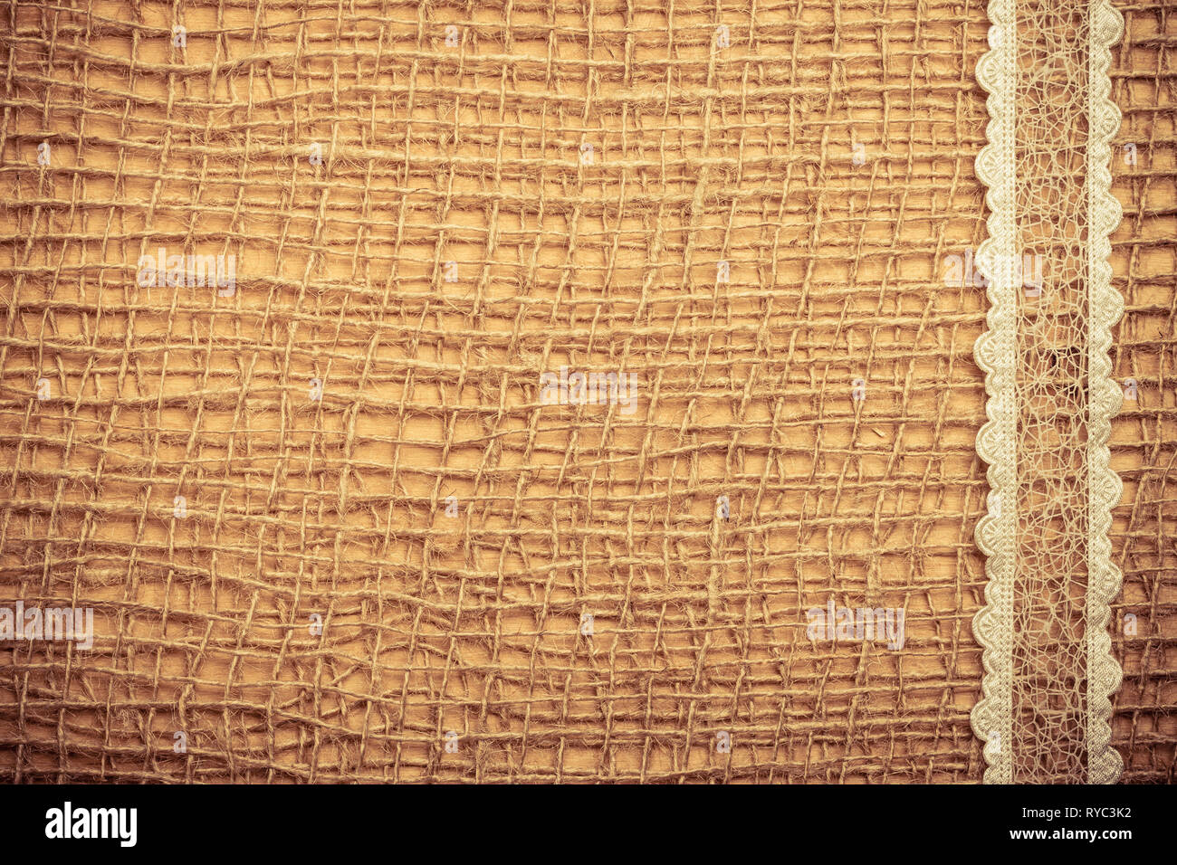 Lace frame on natural mesh material, brown burlap cloth background ...