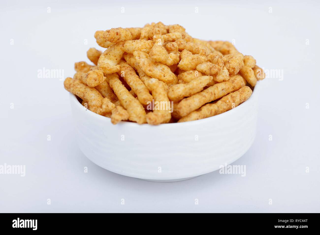 kurkure high resolution stock photography and images alamy https www alamy com picture of namkeen kurkure in the bowl isolated on the white background image240597192 html