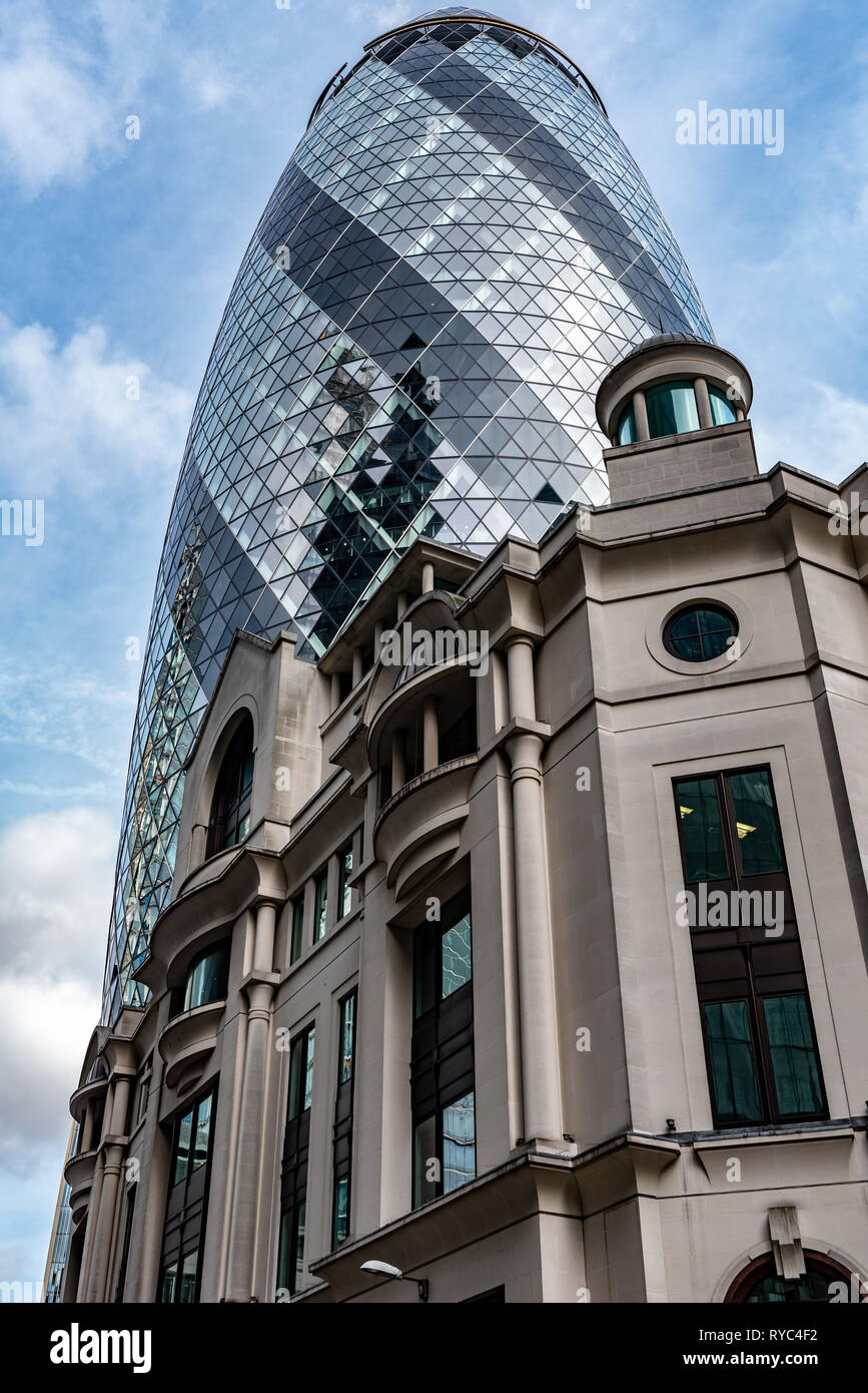 The "Gherkin" towers over Fitzwilliam House in St Mary Axe Stock Photo Alamy
