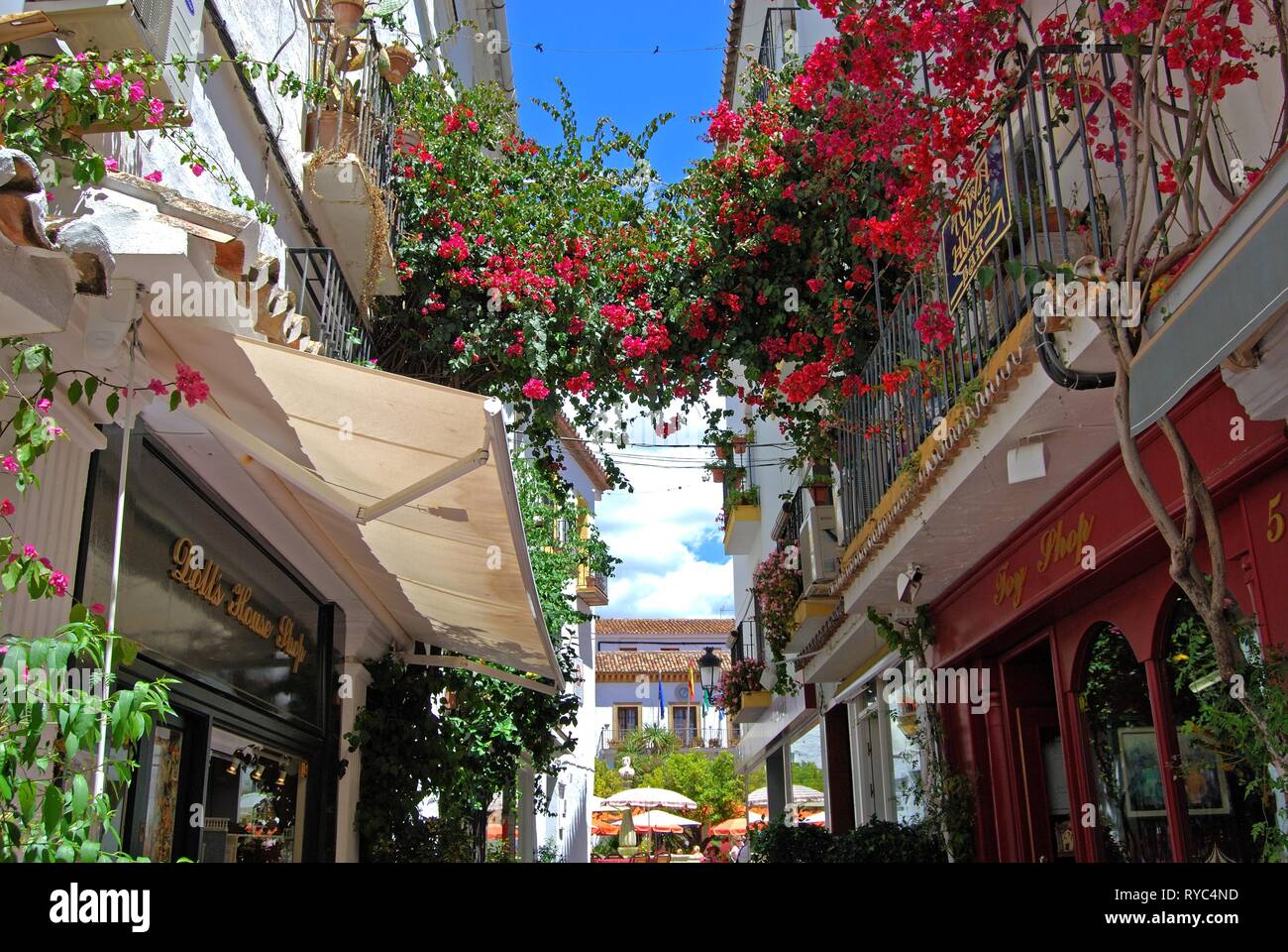 Narrow shopping alleyway leading to Orange Square in the old town with