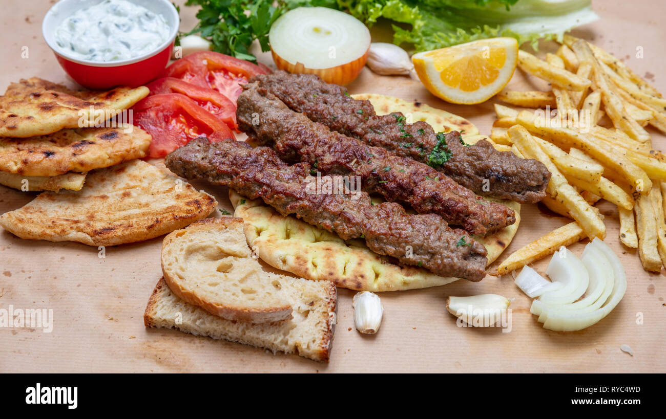 Kebab, traditional turkish, greek meat food on pita bread, tzatziki