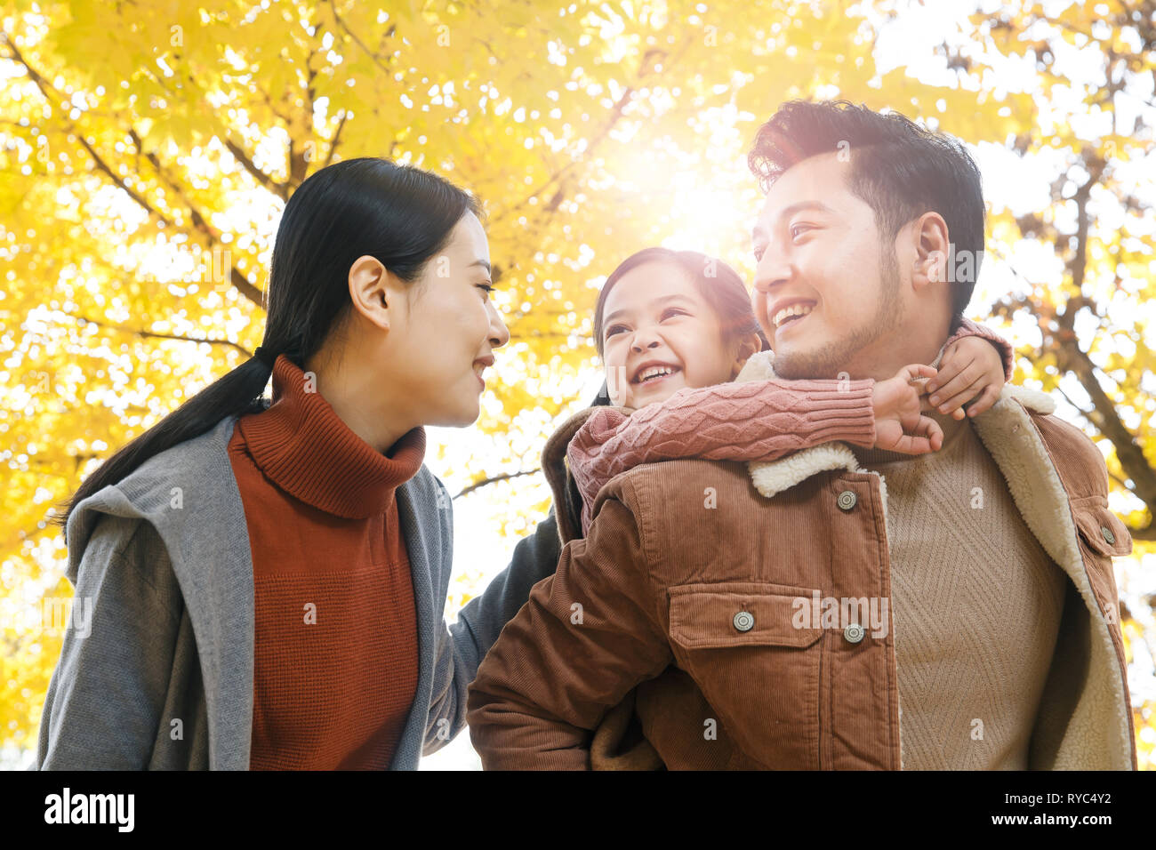 Three play outdoors Stock Photo - Alamy