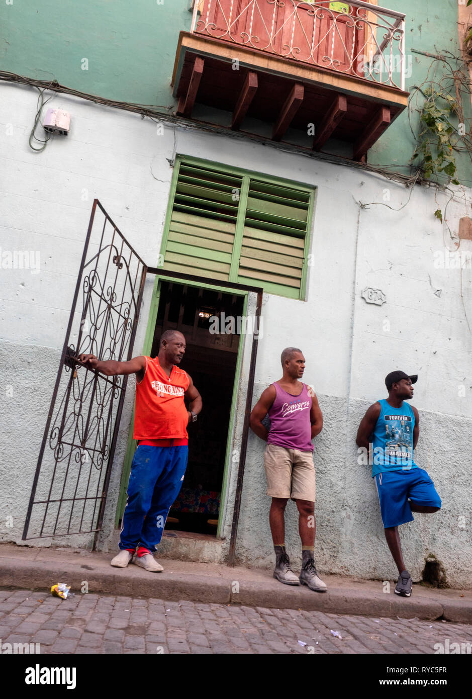 Hanging out in Havana, Cuba: men in a back street of the capital Stock Photo