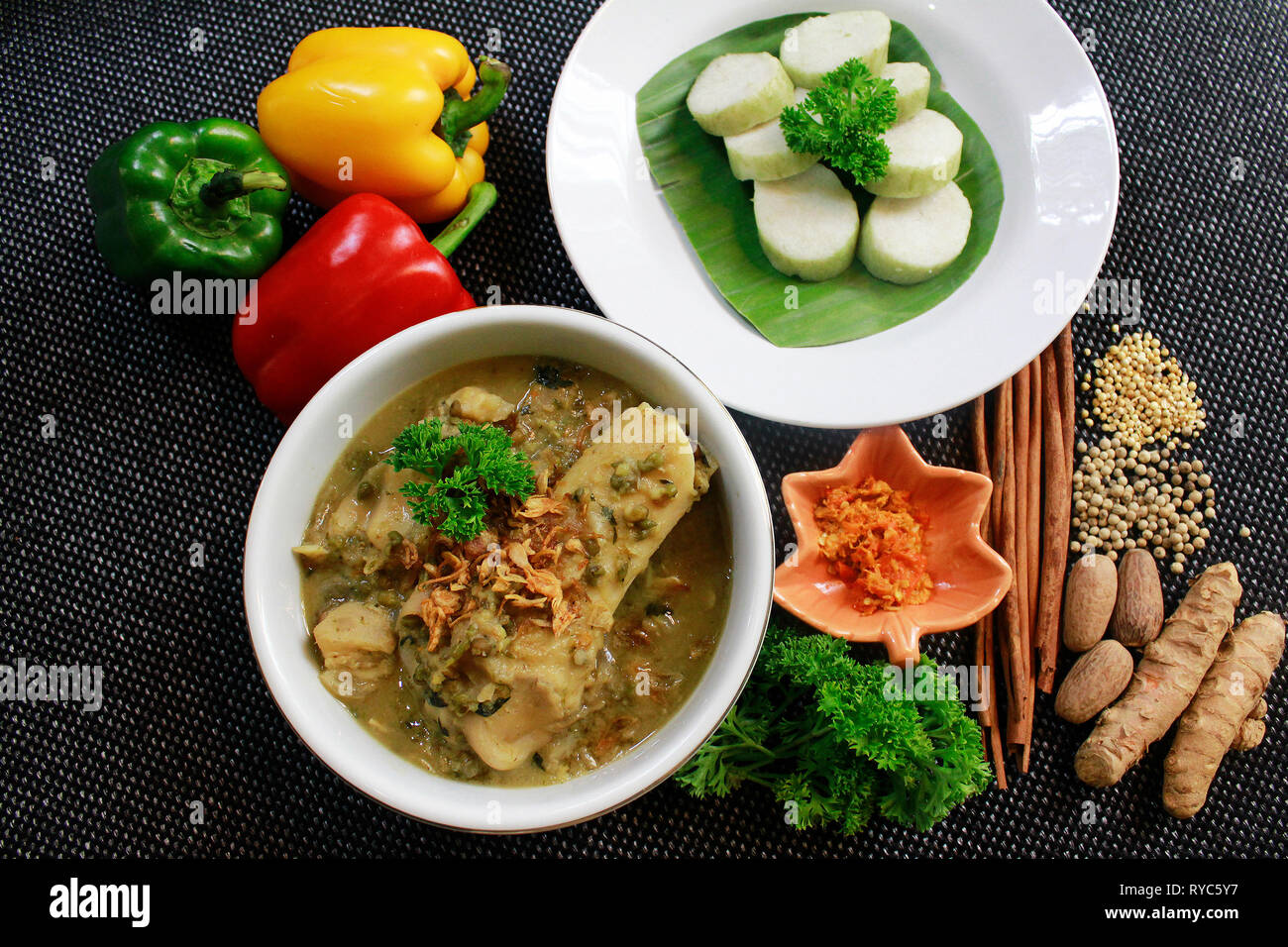 Gnarly Broth or Kaldu Kokot in bahasa Indonesia. Food from Sumenep, Madura Island - Indonesia. Made with beef & cow's foot and green beans. With lonto Stock Photo