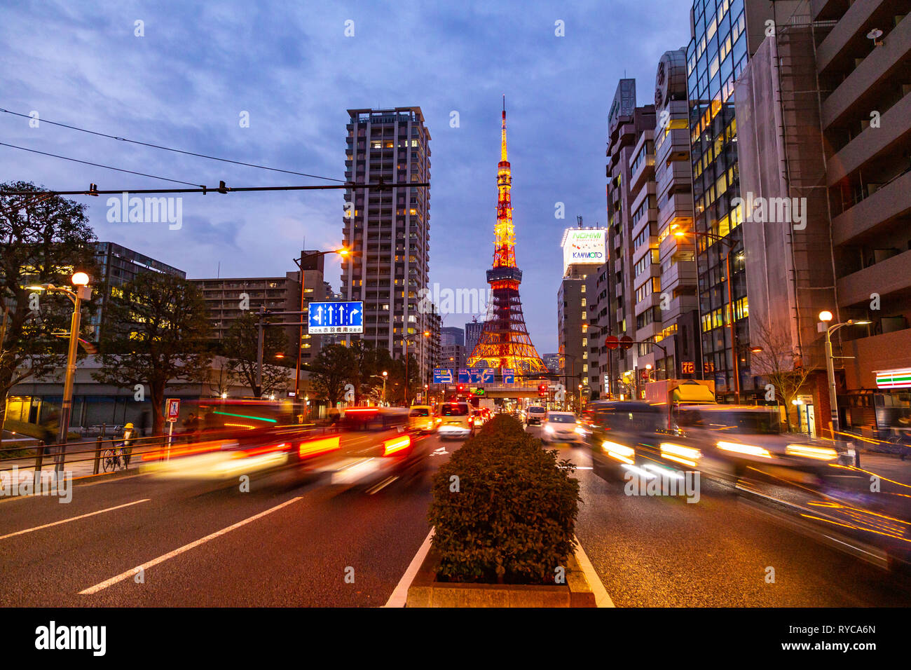 Tokyo, Japan - 22 February 2019 - Timelapse of Tokyo Tower, a famous landmark of Japan, stands tall against late evening sky and Tokyo city lights wit Stock Photo