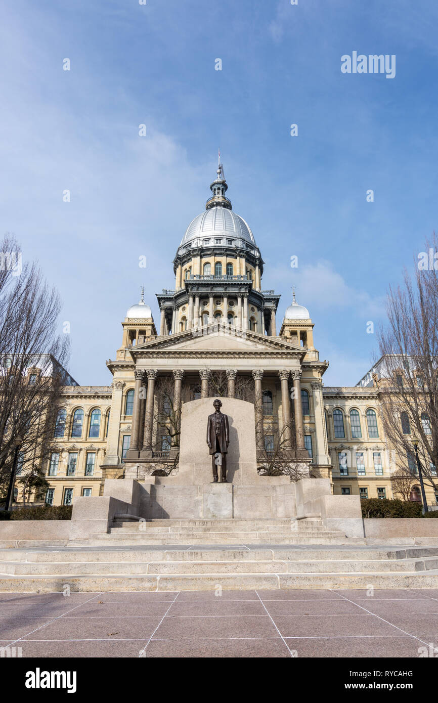 Abraham Lincoln statue standing proud in front of the state capitol