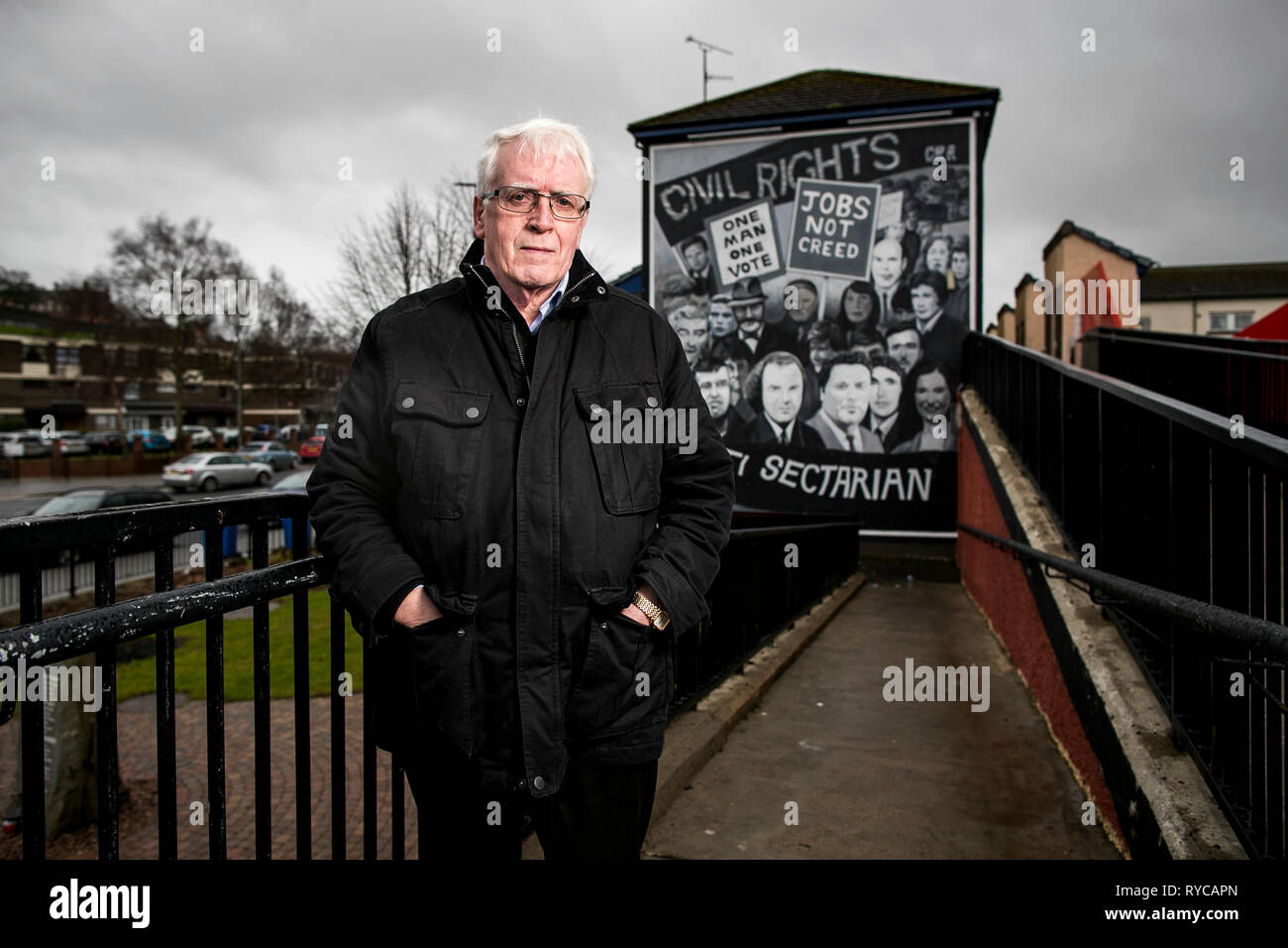 John Kelly whose brother 17 year old Michael was killed in Derry on Bloody Sunday standing beside the Civil Rights Bogside mural. The Public Prosecution Service is expected to announce on Thursday whether it will pursue prosecutions against soldiers over the deaths of 13 people in Londonderry on January 30 1972. Stock Photo