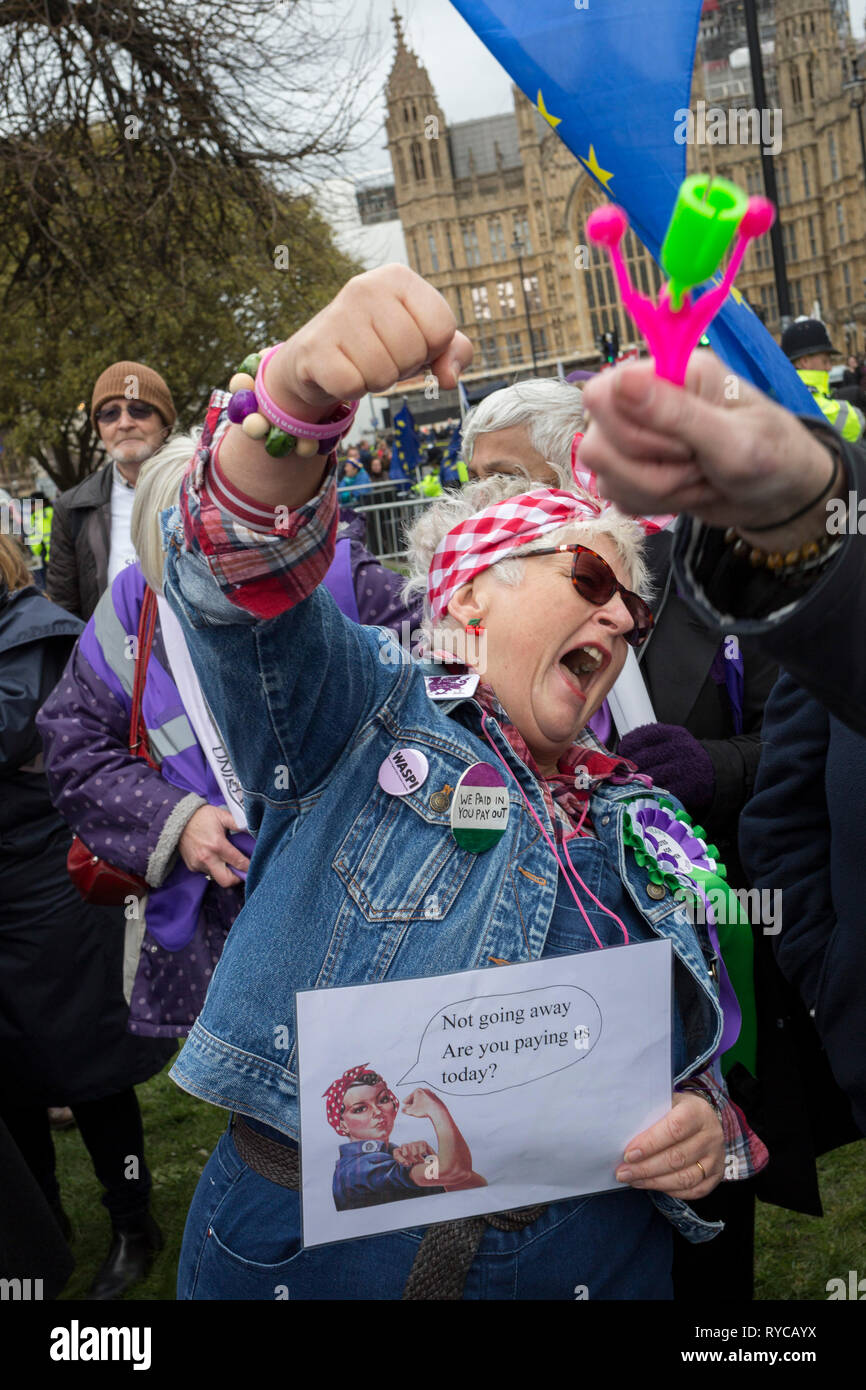 Women from the Essex branch of the WASPI (Women's Action Against State Pension Injustice) protest on College Greeen in Westminster, the morning after another of Prime Minister Theresa May's Brexit deal votes failed again in Parliament, on 13th March 2019, in London, England. Stock Photo
