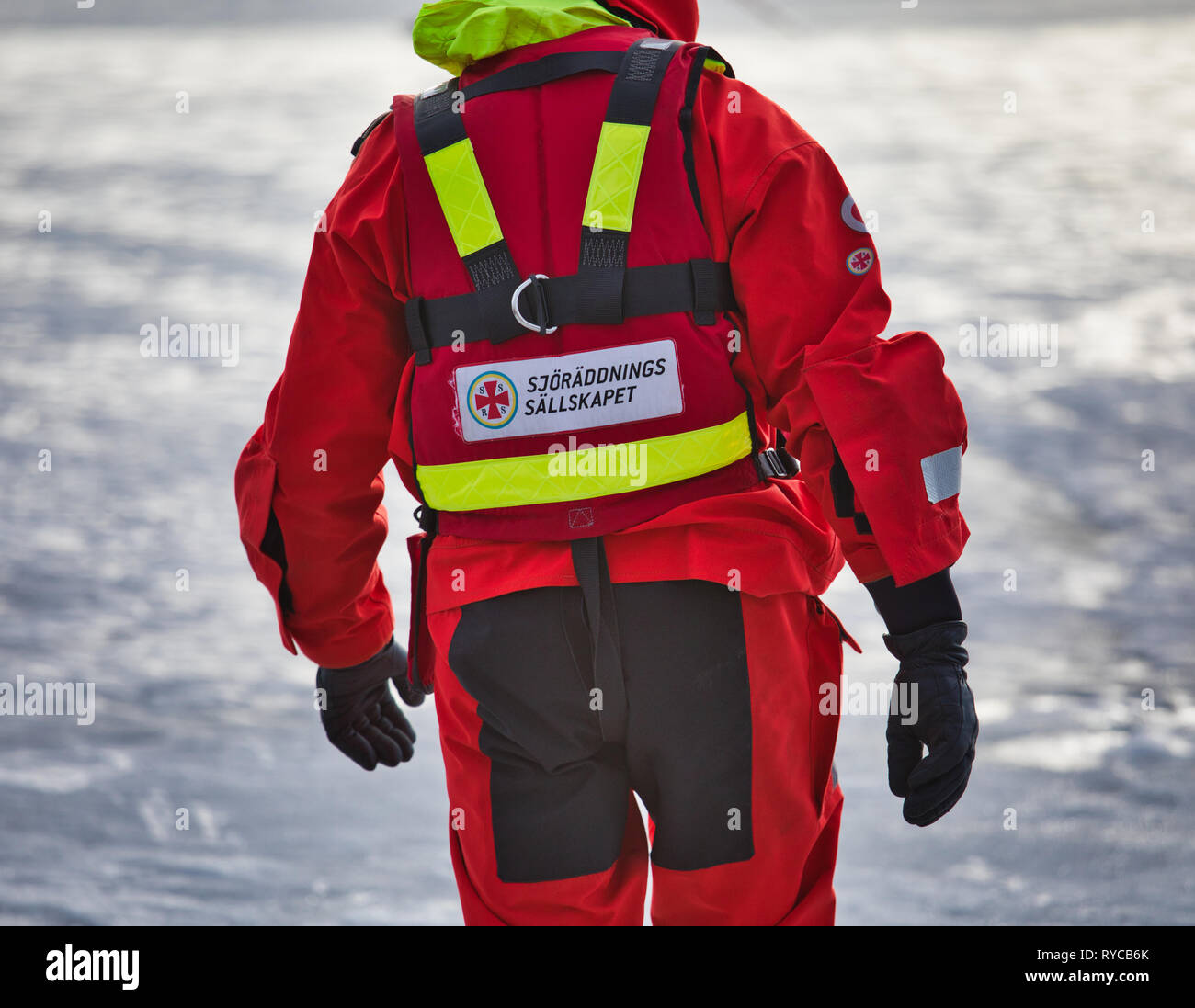 Volunteer from the Swedish Sea Rescue Society (Sjoraddnings Sallskapet) walking on frozen Lake Malaren, Sweden, Scandinavia Stock Photo