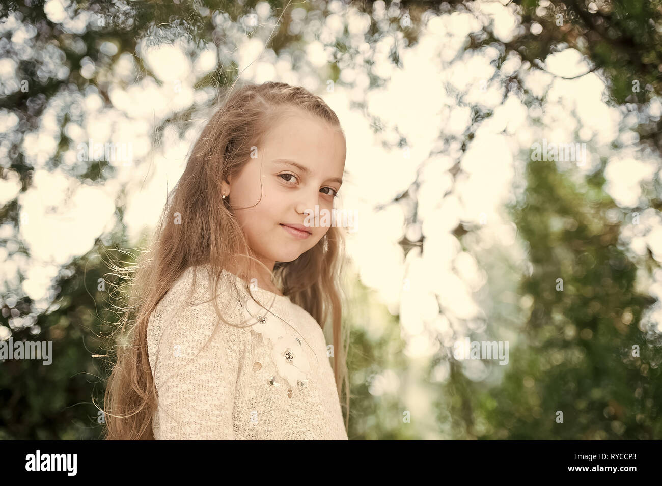 Portrait Of A Lovely Little Happy Princess Girl With Long Blonde