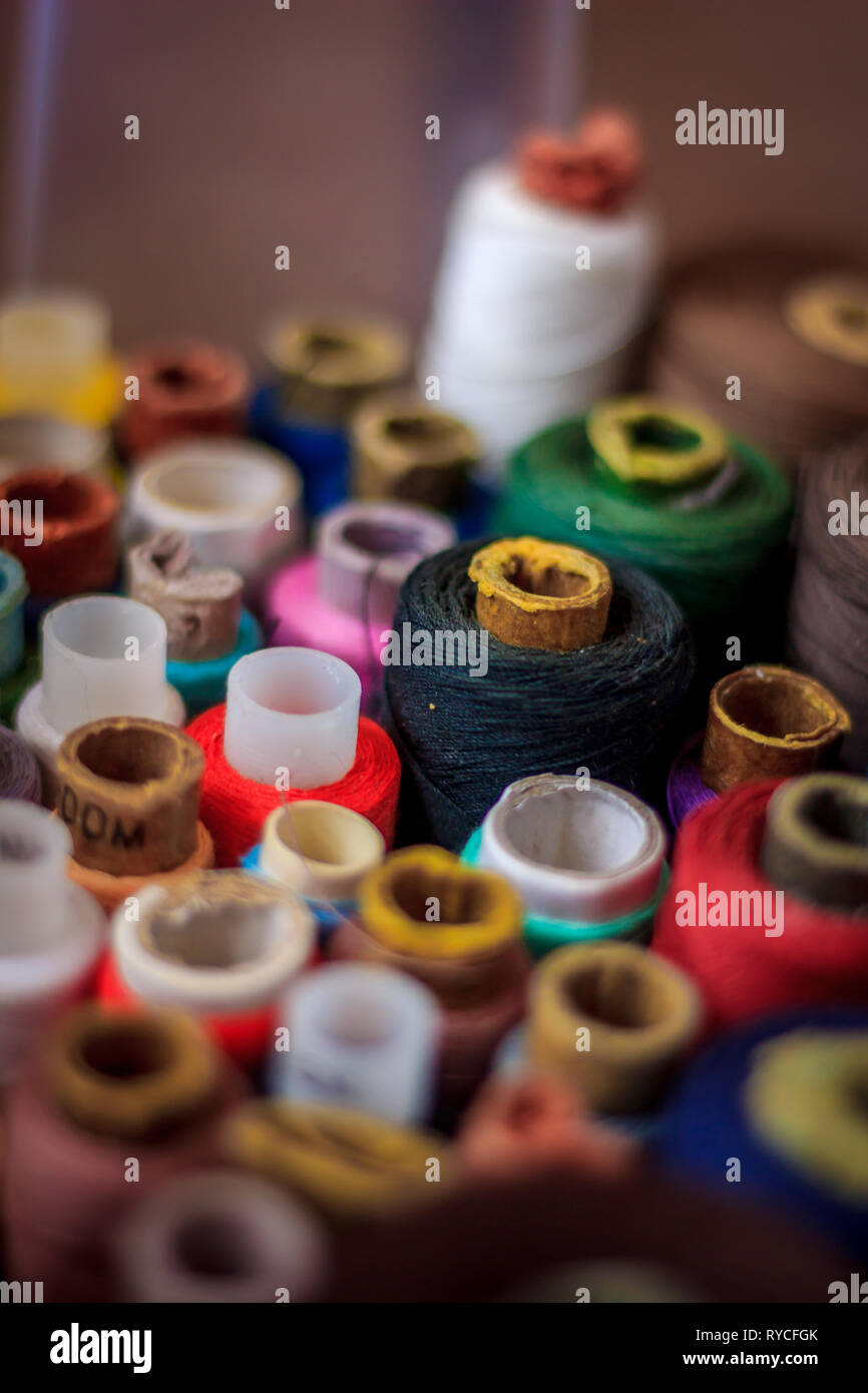 many spools of thread. multi-colored thread. preparation for sewing. needlework. hobby. Stock Photo