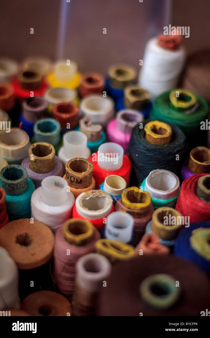 many spools of thread. multi-colored thread. preparation for sewing. needlework. hobby. Stock Photo