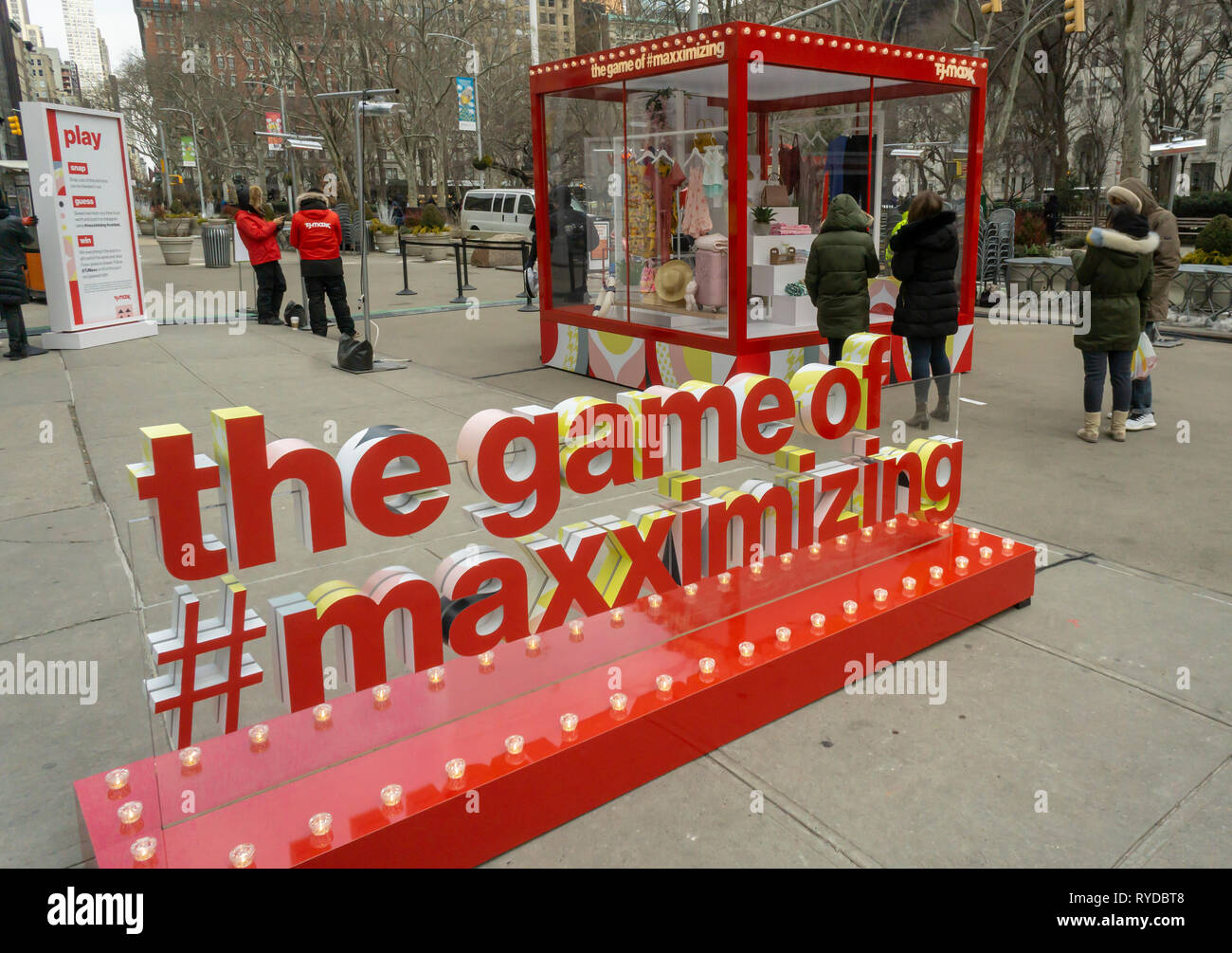 Contestants participate in a pricing competition for a $5 gift card from T.J. Maxx stores in Flatiron Plaza in New York on Wednesday, March 6, 2019. The TJX Companies, parent of Marshalls and T. J. Maxx, created the 'Game of Maxximizing' promotion as a branding event.  (Â© Richard B. Levine) Stock Photo