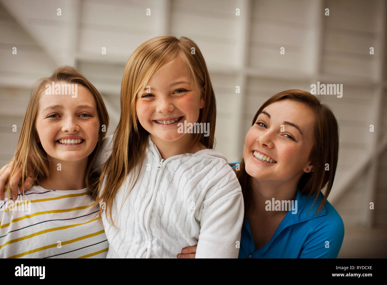 Portrait of three smiling sisters. Stock Photo