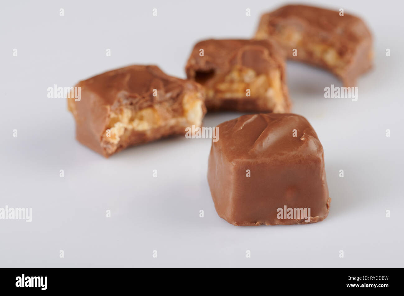 Chocolate candy bar on bited bars background Stock Photo