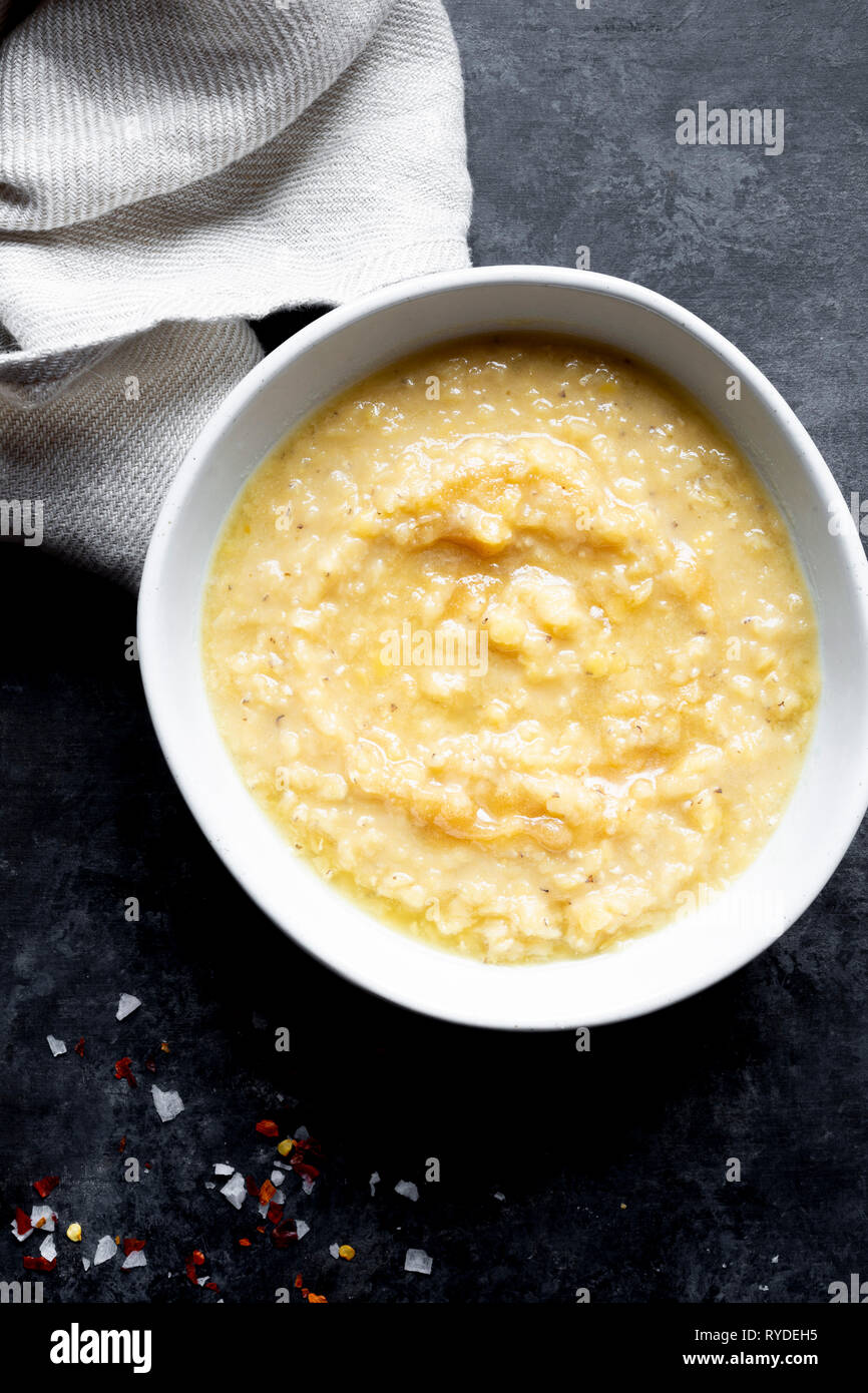 Boiled Red Lentil soup with ghee and salt. Stock Photo