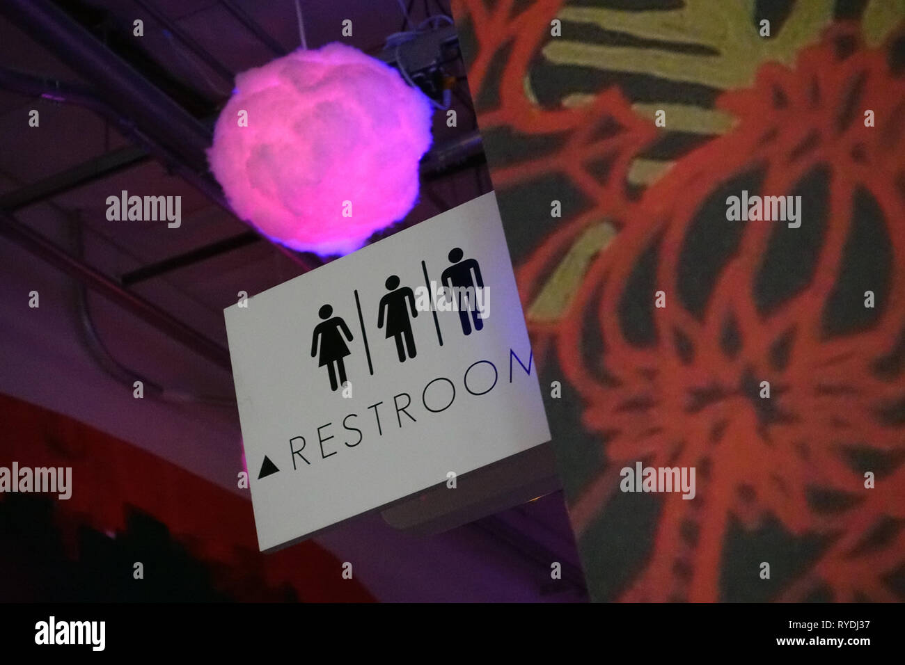 A transgender bathroom sign inside of an art exhibit titled Meow Wolf in Santa Fe, New Mexico. Stock Photo