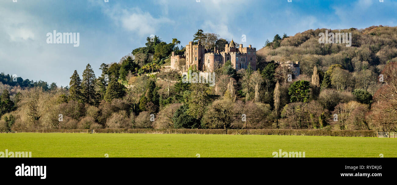 Early spring view of Dunster castle near Minehead from the castle meads West Somerset UK Stock Photo