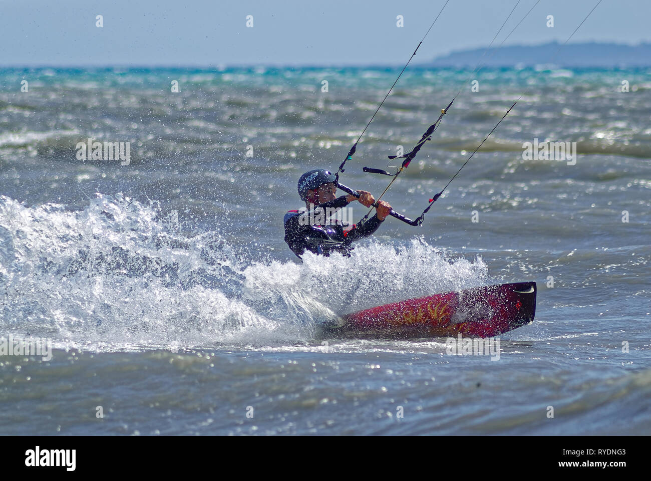 Kite boarder in the waves during a windy day in french riviera Stock Photo